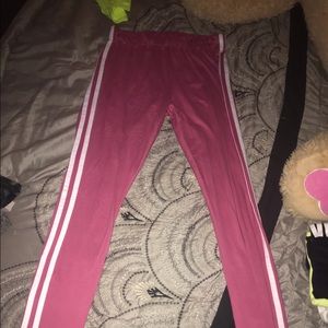 Pink leggings with white striped down the side